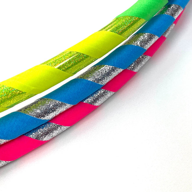 Colorful Hoopologie hula hoops inspired by The Hoop Troop book, part of the holiday gift pack for active kids.