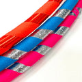 Colorful Hoopologie hula hoops inspired by The Hoop Troop book, part of the holiday gift pack for active kids.