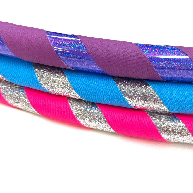 Colorful Hoopologie hula hoops inspired by The Hoop Troop book, part of the holiday gift pack for active kids.