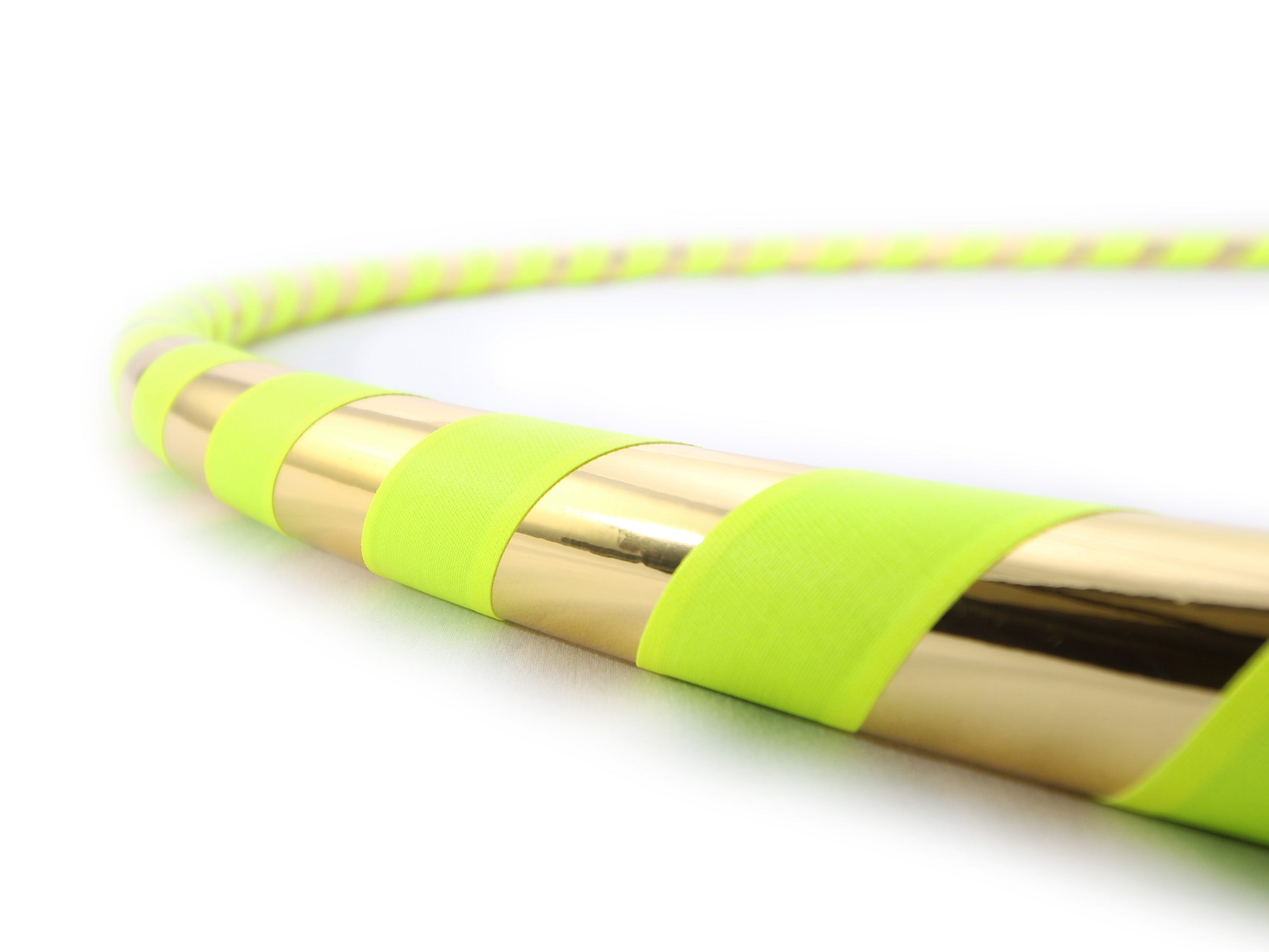 yellow hula hoop with mirror tape on a white background